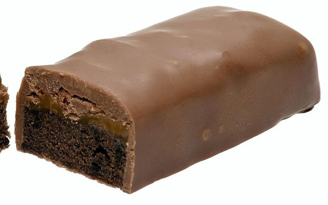 A salted caramel fudge square dusted with sea salt